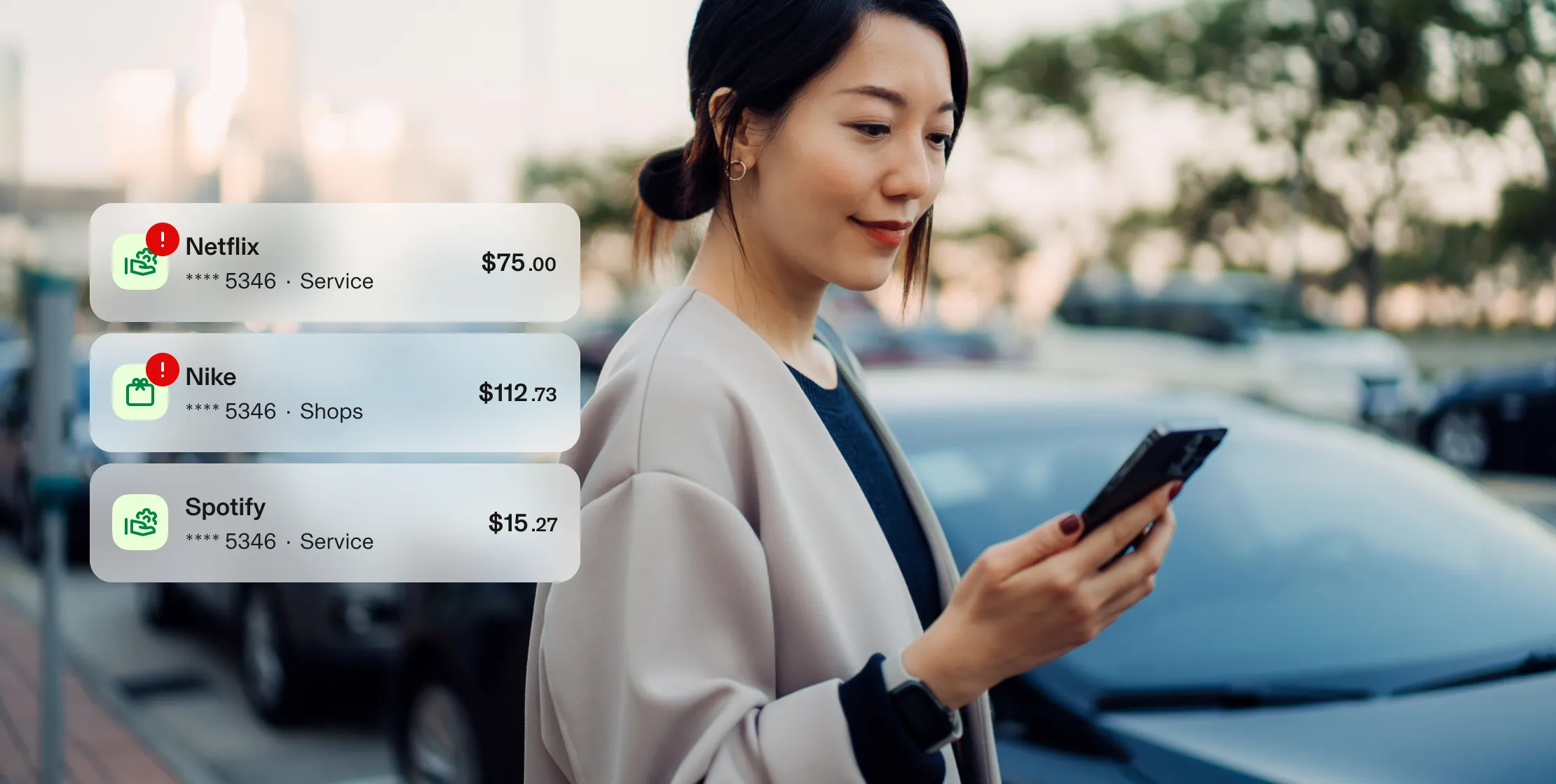 Woman looking at phone. Aura UI showing over limit transactions from Netflix and Nike. 